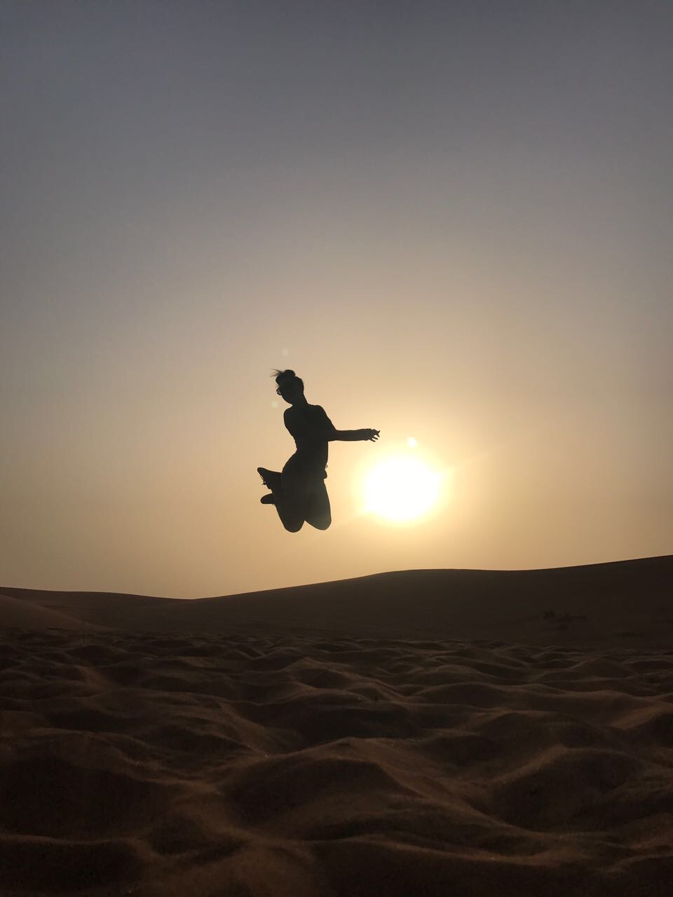 Person jumping at sunset in Dubai – AED 3,000 Invite Program